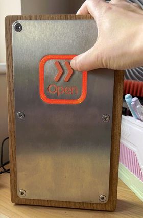 An action shot of my hand pressing the button - the orange ring has lit up.