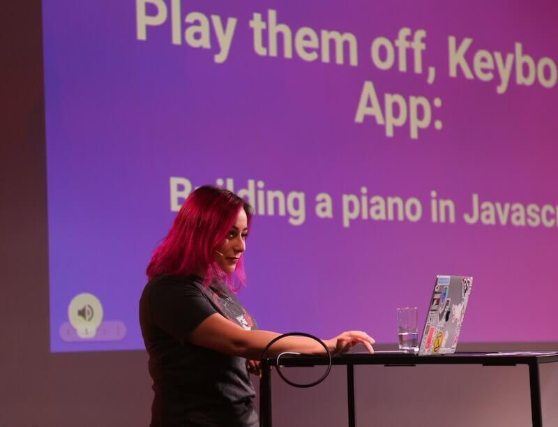 Sophie on stage at BeJS Conference with her talk Play Them Off, Keyboard App: Building a virtual piano in JavaScript